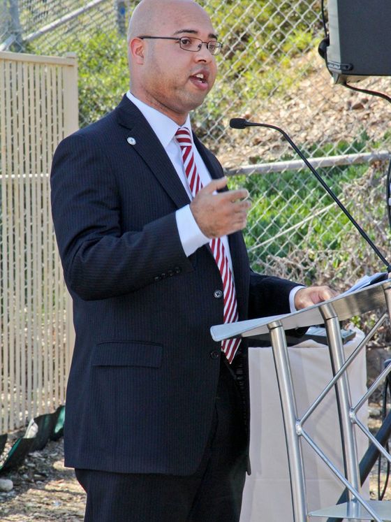 Erik Caldwell speaking at an outdoor lectern at the Chollas Creek restoration groundbreaking in San Diego