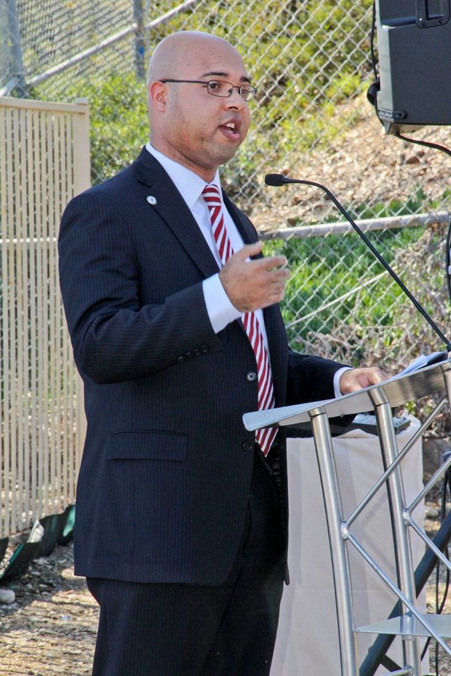 Erik Caldwell speaking at an outdoor lectern at the Chollas Creek restoration groundbreaking in San Diego